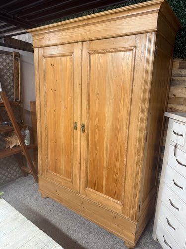 This charming antique pine wardrobe combines timeless style with practical functionality. Structurally sound and well-preserved for its age, it offers generous storage space featuring three hanging rails, perfect for organizing your clothes and accessories. Designed for convenience, the wardrobe can be disassembled into sections, making it easier to move and fit into your space. Its warm pine finish adds a cozy, vintage touch to any room, bringing both character and utility to your home.

Overall Dimensions