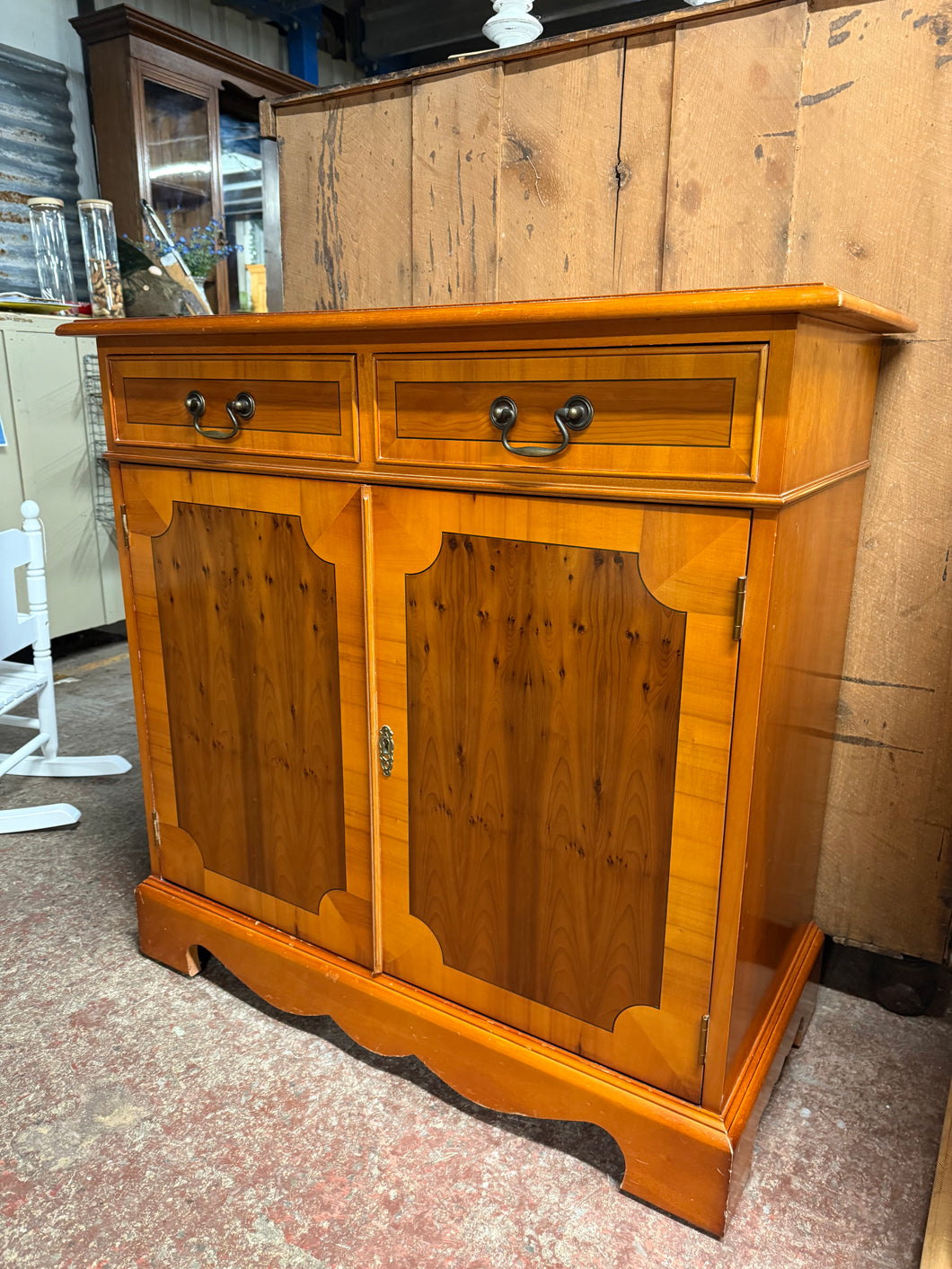 This sweet yew wood sideboard is structurally sound and in good condition minus a few small marks etc. It has 2 short dovetail jointed drawers over a double cupboard with 1 long shelf in.

Overall Dimensions

88cm wide x 41cm deep x 86cm high 

DELIVERY AVAILABLE    

HAVE THIS PAINTED A COLOUR OF YOUR CHOICE FOR AN EXTRA £70 

For our other items see our website https://fossewayfurniture.co.uk

collection from cv36 or bs36
