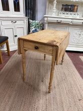 Load image into Gallery viewer, This stunning antique pine drop leaf table is structurally sound and in great condition for its age. It is used and does have some marks but nothing too major at all. It has 1 long drawer for storage. This table can extend easily to seat 6 people.

Overall Dimensions

46.5cm wide x 90cm long x 72cm high

93cm wide when extended

DELIVERY AVAILABLE    

For our other items see our website https://fossewayfurniture.co.uk

collection from cv36 or bs36

