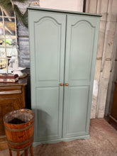 Load image into Gallery viewer, This stunning solid pine wardrobe has been painted in &#39;Serenity&#39; by Rustoleum. It is structurally sound and in great condition. It has 1 long hanging rail inside for storage.

Overall Dimensions

89cm wide x 54cm deep x 178.5cm high

DELIVERY AVAILABLE    

For our other items see our website https://fossewayfurniture.co.uk

collection from cv36 or bs36

