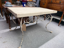 Load image into Gallery viewer, Crafted from wrought iron with authentic vintage appeal, this French side table brings elegance to any interior. The weathered patina and ornate ironwork reflect genuine character and quality craftsmanship.&nbsp;

Delivery Available

Overall Dimensions

91cm wide x 58cm deep x 59cm high&nbsp;

