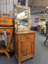 Load image into Gallery viewer, Crafted from quality hardwood, this side table combines practical storage with timeless style. Features one drawer and cupboard space—ideal for keeping essentials within arm's reach. Shows gentle signs of age and use, adding character to any room. A sturdy, functional piece perfect for living spaces or bedrooms.

Delivery Available

Overall Dimensions

44.5cm wide x 31cm deep x 65cm high

