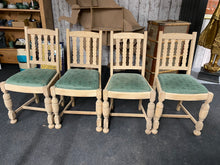 Load image into Gallery viewer, Transform your space with these 4 stunning oak chairs, stripped down to their beautiful, natural wood. Let the vibrant emerald green seat pads add a pop of color, or easily recover them to match your personal style.  Please note this item is bare wood so hasn&#39;t had any wax etc for protection. We recommend &#39;Clear Wax&#39; by Frenchic.  Overall Dimensions  approx : 46cm wide x 42cm deep x 90.5cm high         DELIVERY AVAILABLE      For our other items see our website https://fossewayfurniture.co.uk
