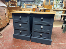 Load image into Gallery viewer, This stunning duo of solid pine bedsides are both structurally sound and in overall good condition. These are very deep bedsides so great for those looking for that extra storage. Each unit has 1 short dovetail jointed drawer and 1 double drawer. The body has been painted in &#39;railings&#39; by Farrow &amp; Ball with the top given an antique pine wax.

Overall Dimensions

41.5cm wide x 60cm deep x 63.5cm high

DELIVERY AVAILABLE    

For our other items see our website https://fossewayfurniture.co.uk

collection from
