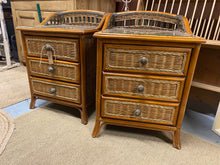Load image into Gallery viewer, Experience the beauty and functionality of our Wicker Bedsides with this stunning pair. The wooden construction and wicker fronted drawers not only create a structurally sound piece, but also add a touch of charm to any room. Keep your belongings safe and organized with the 3 handy drawers in each unit, and protect the surface with the removable glass top.  
