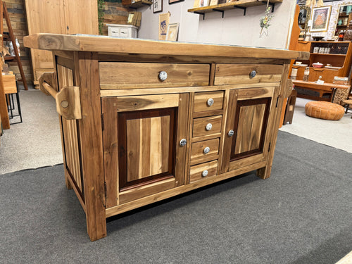 This beautiful mahogany kitchen island has been carefully stripped and protected with a matt varnish. It offers plenty of storage space, featuring 2 long dovetail-jointed drawers, 4 smaller drawers, and 2 cupboards with internal shelves. Both drawers and cupboards are accessible from either side. The elegant black granite top completes its look. This pre-owned piece shows minor marks, but nothing significant.

Overall Dimensions

148cm wide x 64cm deep x 85cm high

DELIVERY AVAILABLE      

For our other it