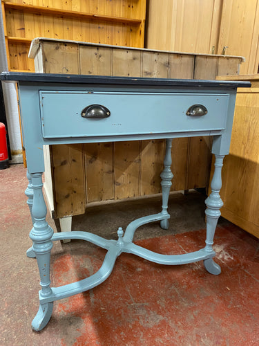 Experience the charm of a hand-painted solid pine hall table with a rustic appeal. While showing some character with a few chips, it is still functional with a spacious dovetail jointed drawer for storage. Painted by its previous owners it could do with a re paint  