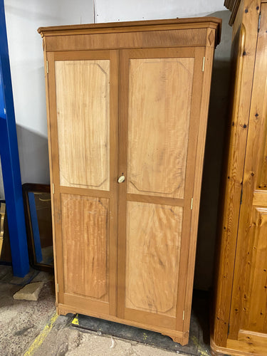 Experience the beauty and durability of our Stripped Mahogany Wardrobe. Carefully crafted and in excellent condition, it has been stripped down to its bare essence, ready to bring a touch of nature to your space. With 1 hanging rail and multiple hooks, it offers ample storage for all your belongings.  