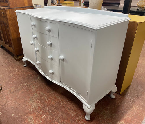 This wooden sideboard, painted in 'Crystal Blue' by Frenchic, offers generous storage. It features 4 long dovetail-jointed drawers and 2 single cupboards, each with a single shelf. Its construction is sound and it is in good condition overall.  Overall Dimensions  138cm wide x 50.5cm deep x 94cm high