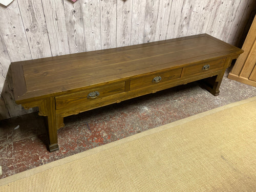 Elevate your hallway with this sturdy and beautifully crafted Oriental-style wooden bench. Despite some minor marks from previous use, its structural integrity remains intact. With three convenient drawers for storage, this bench is both functional and decorative. 