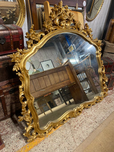 This stunning, oversized ornate mirror is sturdy and in excellent condition. Both the frame and glass are in great condition. It is the ultimate touch of elegance for any space.  Overall Dimensions  122cm wide x 119cm high   D