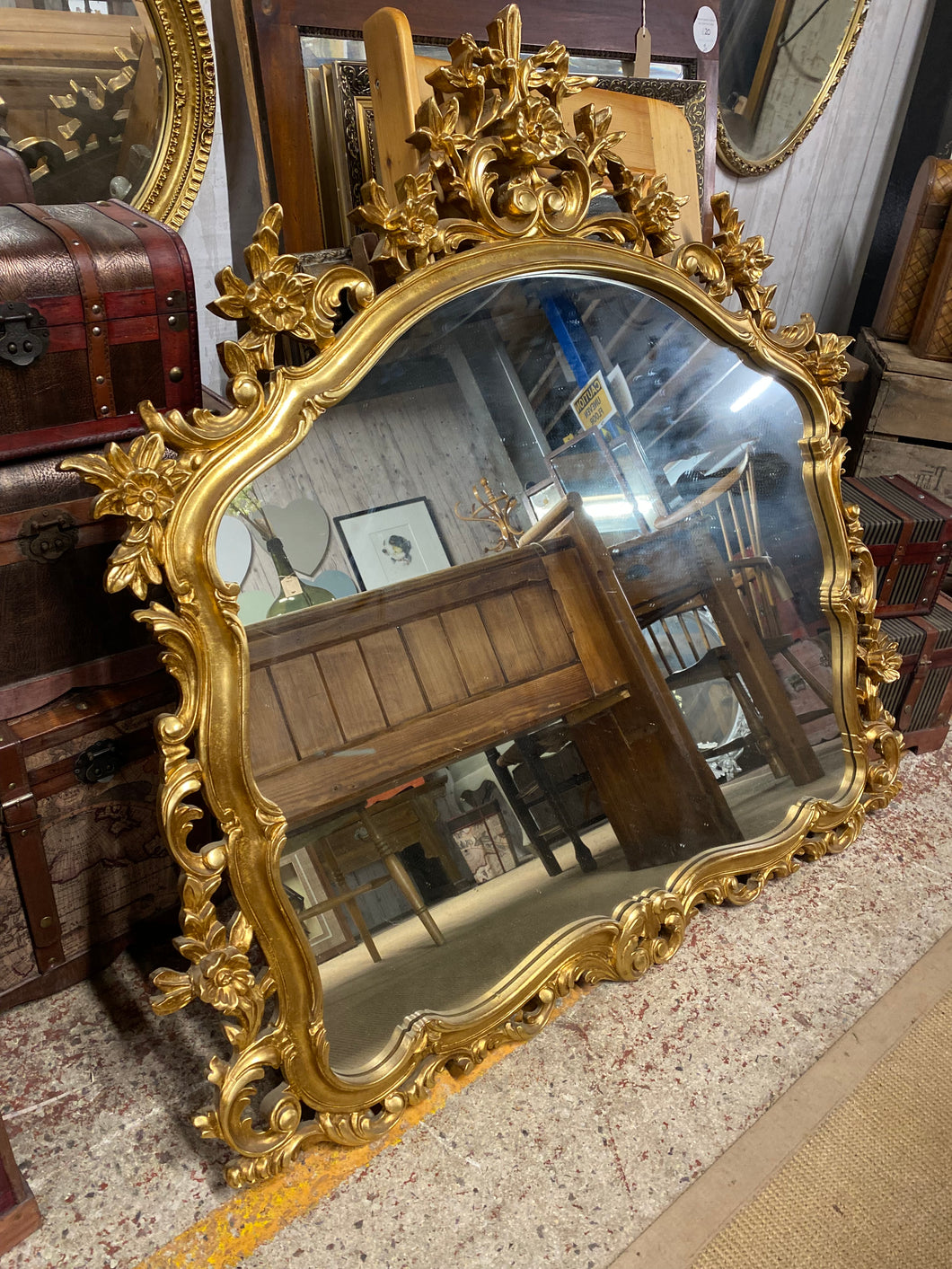 This stunning, oversized ornate mirror is sturdy and in excellent condition. Both the frame and glass are in great condition. It is the ultimate touch of elegance for any space.  Overall Dimensions  122cm wide x 119cm high   D