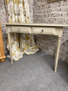 Experience the stunning beauty and durability of our console table, expertly crafted and in pristine condition. With a charming beige color and a richly applied browning wax for a vintage touch, this piece also offers convenient storage with 2 short drawers  