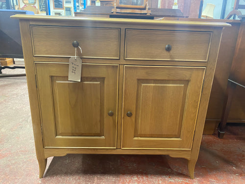 This gorgeous, contemporary double sideboard is in perfect condition and can store everything you need! It features two short drawers above a double cupboard, with one spacious shelf inside.  Overall Dimensions  98cm wide x 46cm deep x 84.5cm high   