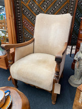 Load image into Gallery viewer, This cream armchair is not only aesthetically appealing, but also structurally sound and in good condition. Although there is a small mark on the seat, a thorough cleaning will easily remove it. The oak frame remains in excellent condition, adding to the overall quality of this stunning piece.  Overall Dimensions  approx : 61cm wide x 62cm deep x 90.5cm high 
