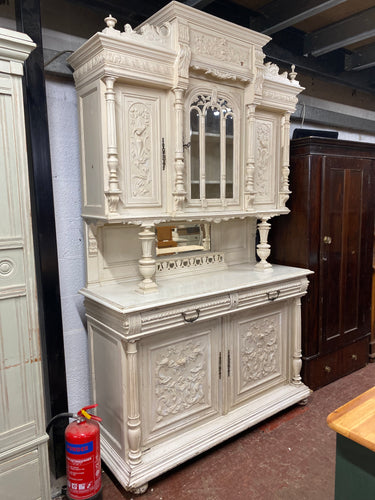 This exquisite French buffet is made of solid wood and is in impeccable condition. While there are a few minor paint marks and small areas of damage, they do not detract from its overall quality. The top is detachable for convenient transportation. The top section boasts 3 cupboards and 2 long shelves, while the base section features 2 drawers over a double cupboard with 1 long shelf inside.  Overall Dimensions  150cm wide x 54cm deep x 247cm high  