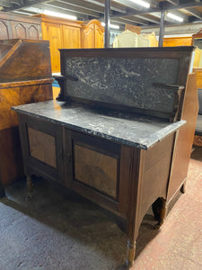 This stunning marble topped washstand is structurally sound and in overall good condition. It is used and does have some marks but nothing too major. The marble is all intact. It has a double cupboard for storage. The marble top comes off for easier moving.  Overall Dimensions  107.5cm wide x 49cm deep x 119cm high  