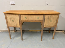 Load image into Gallery viewer, This stunning gorgeous completely stripped back mahogany serpentine dresser is structurally sound and in good condition. It is used and does have the odd mark but nothing too major. It has ample storage with 2 cupboards and 1 long dovetail jointed drawer. The original handles have been kept but have been blasted gold.  Please note this item is bare wood so hasn&#39;t had any wax etc for protection. We recommend &#39;Clear Wax&#39; by Frenchic.  Overall Dimensions  152cm wide x 58.5cm deep x 91.5cm high 
