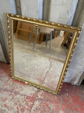 Load image into Gallery viewer, This stunning small gold and black framed mirror is structurally sound with no cracks etc to the glass. The frame however does have a small chunk missing.  Overall Dimensions  52.5cm wide x 62.5cm high 
